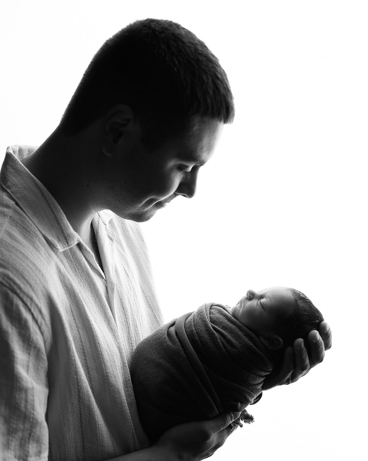 Professional photo of a family with their newborn baby
