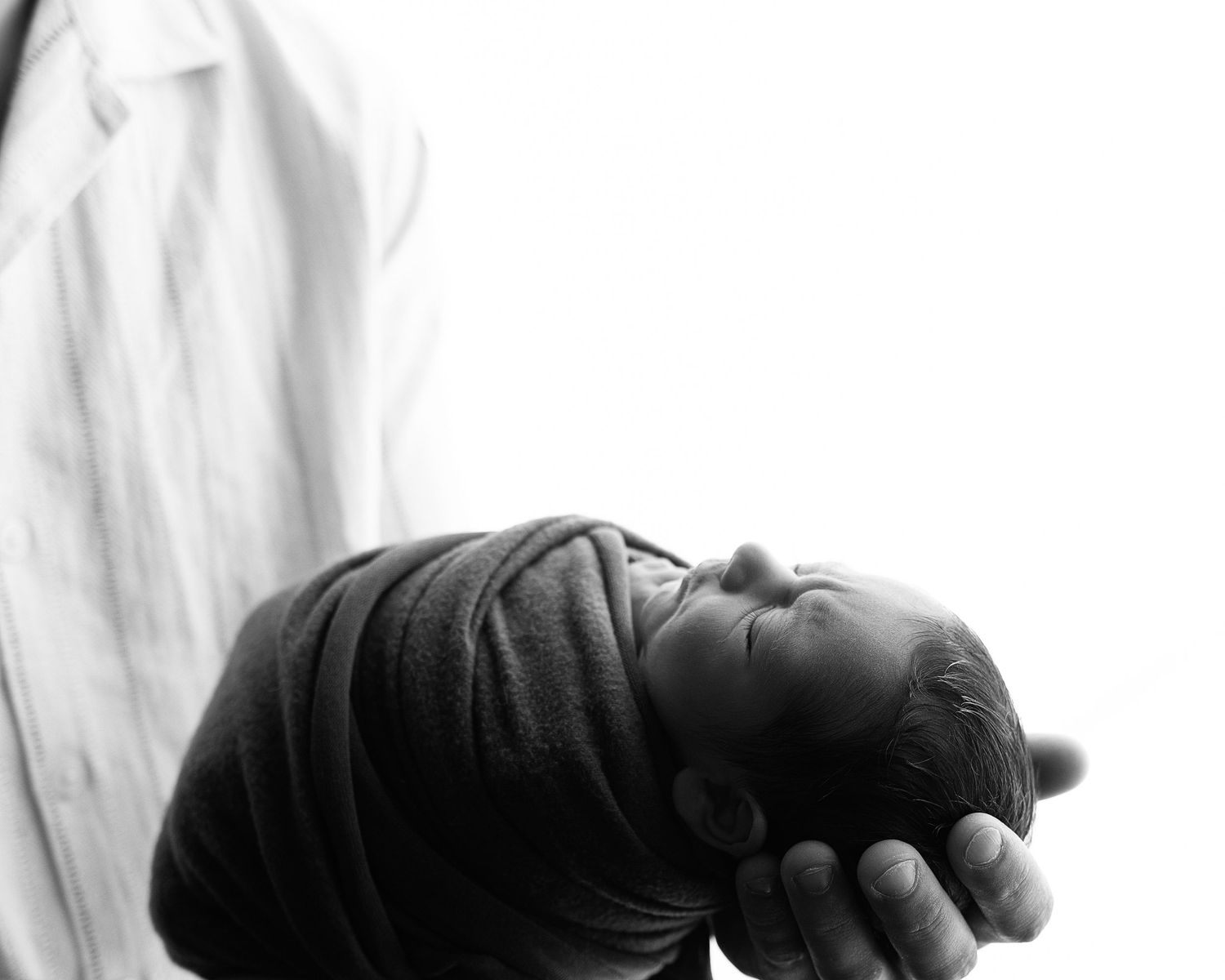 Professional photo of a family with their newborn baby