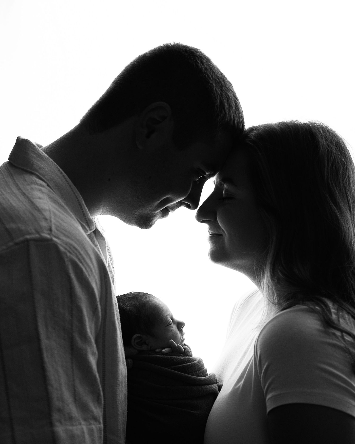 Professional photo of a family with their newborn baby