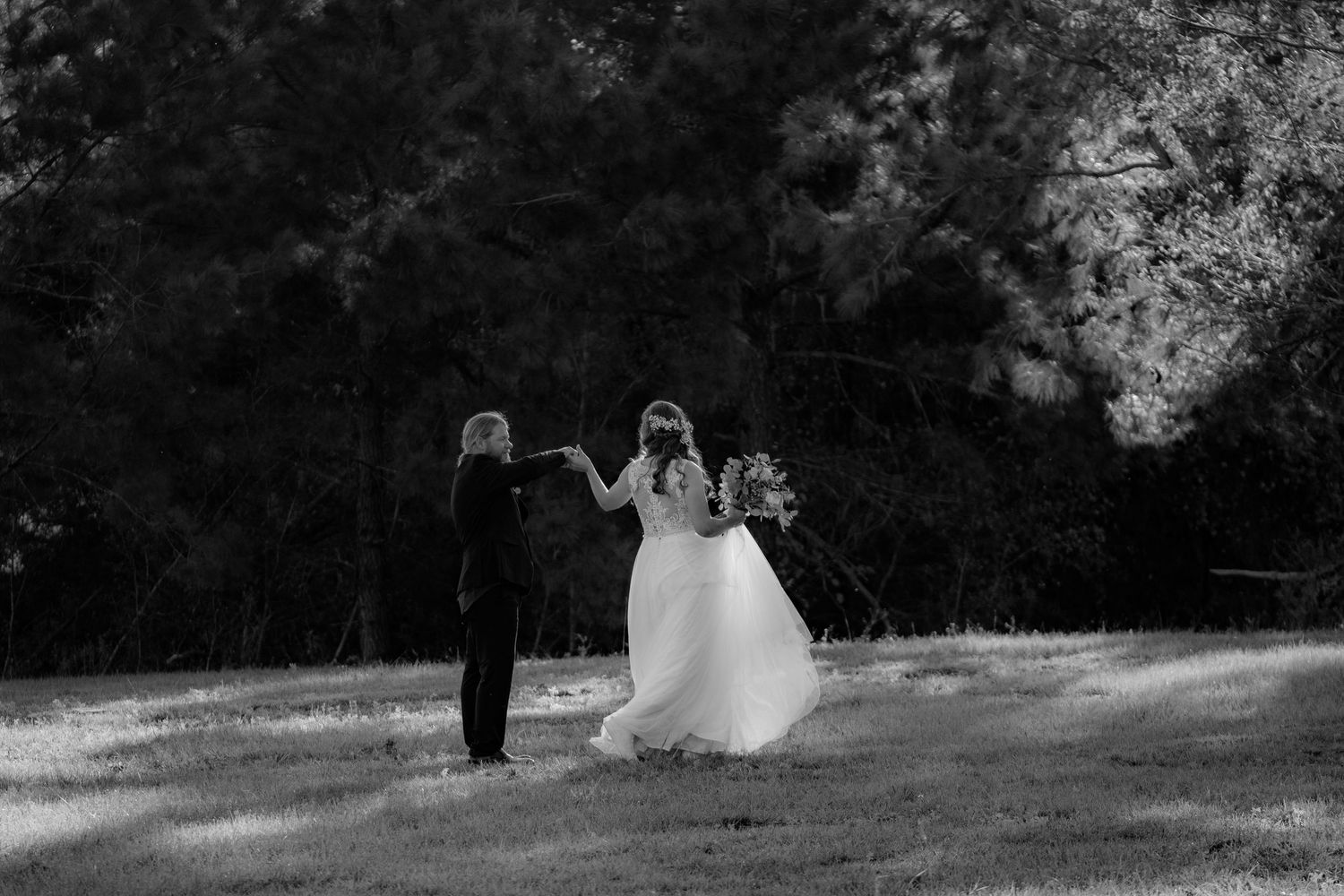 Outdoor wedding ceremony moment captured in black and white photography.