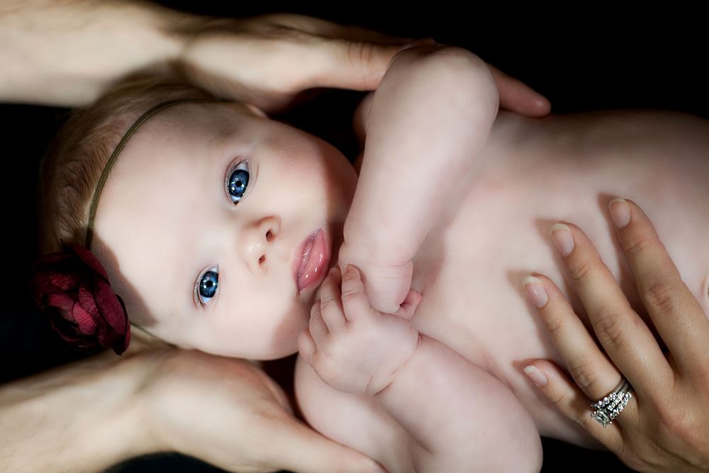 Artistic black and white close-up portrait series with soft lighting.