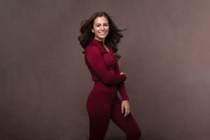 Athletic figure in burgundy workout attire strikes dynamic poses in studio setting.