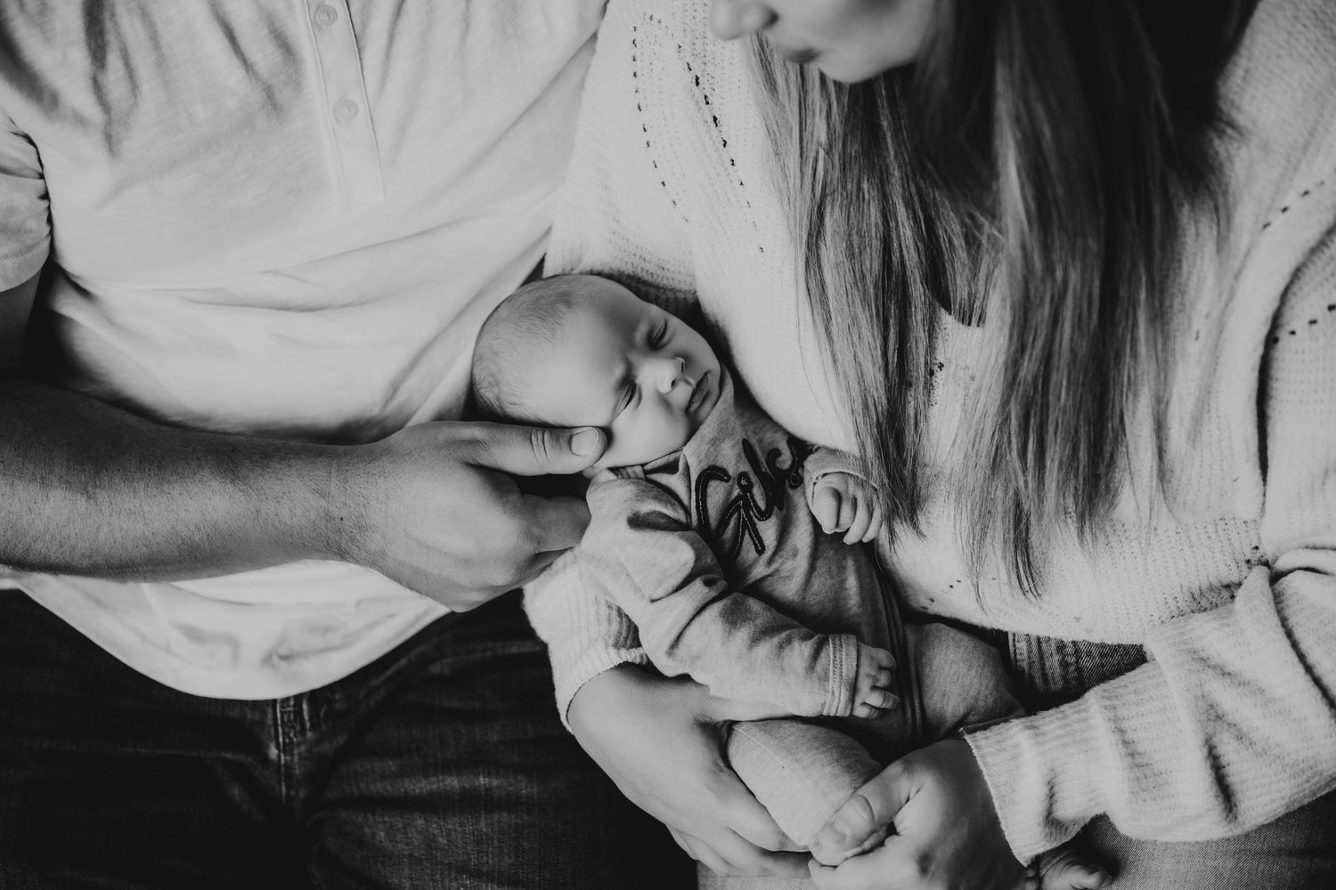 Black and white collage showing close-up intimate moments between a couple in casual attire.