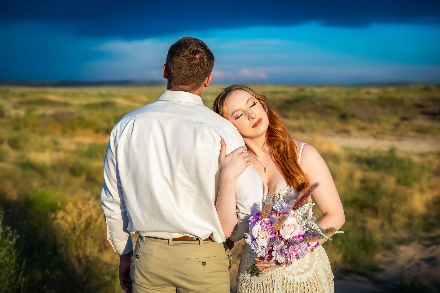 bride and groom in the sun with blue skies