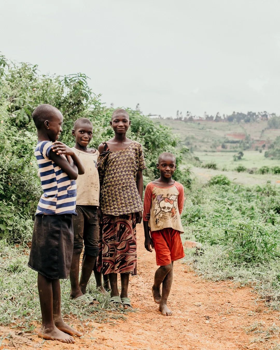 Family stands together on farmland, representing rural community, farming life and shared resilience