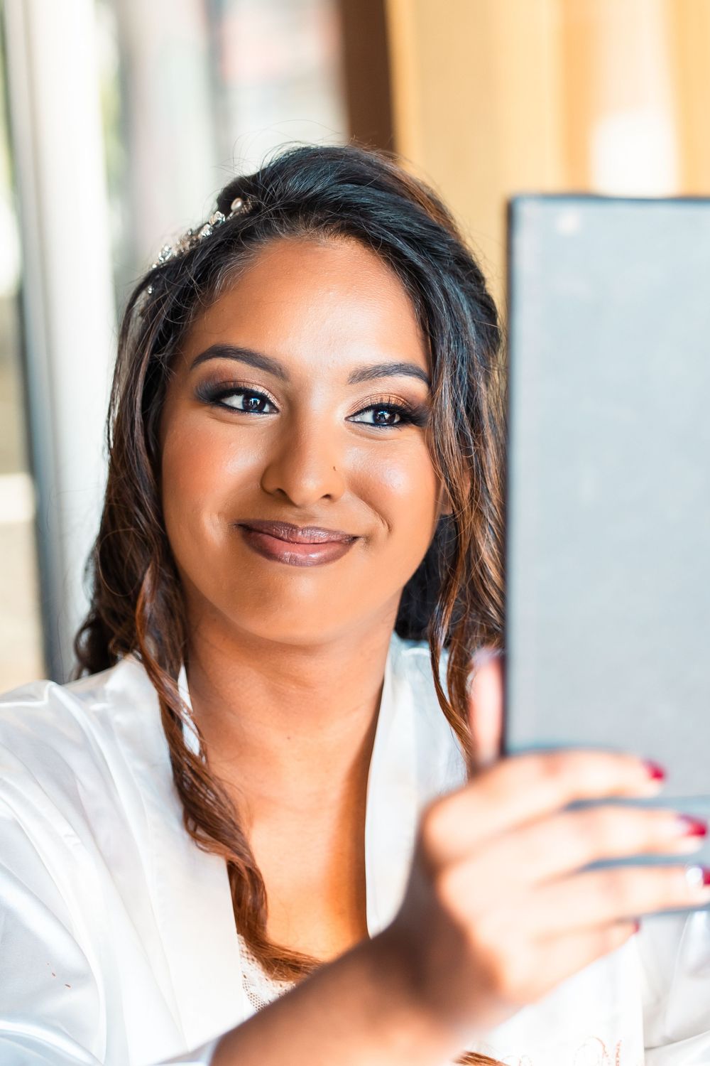 Close-up portrait shots showing joyful expressions and glowing makeup.