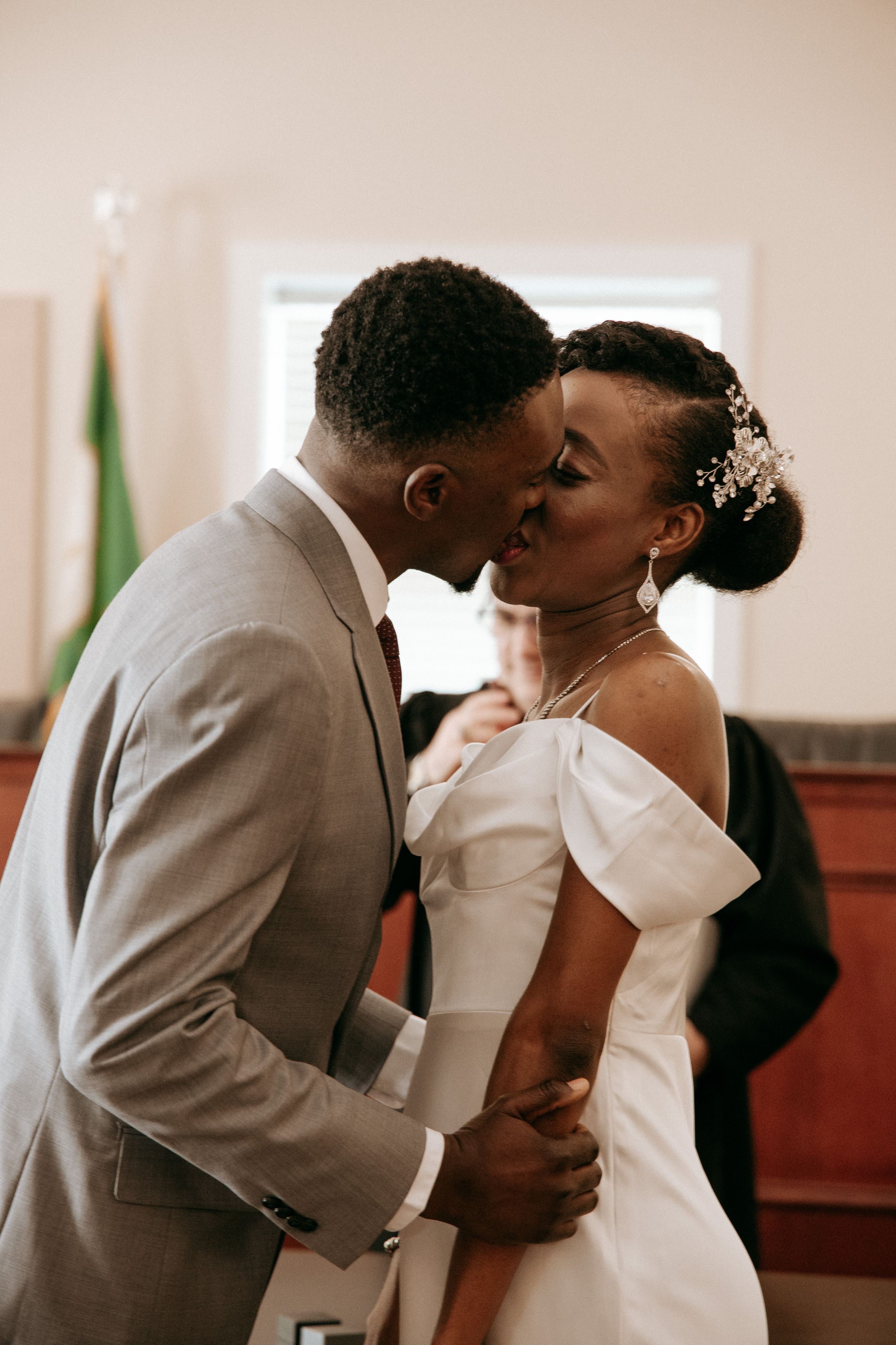 Intimate moment between newlyweds in church setting.