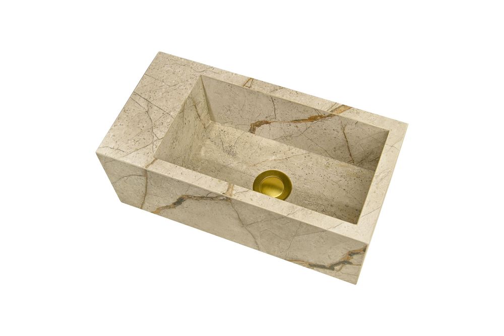 Rectangular cream marble sink with gold drain, wall-mounted vessel basin with natural stone veining pattern.