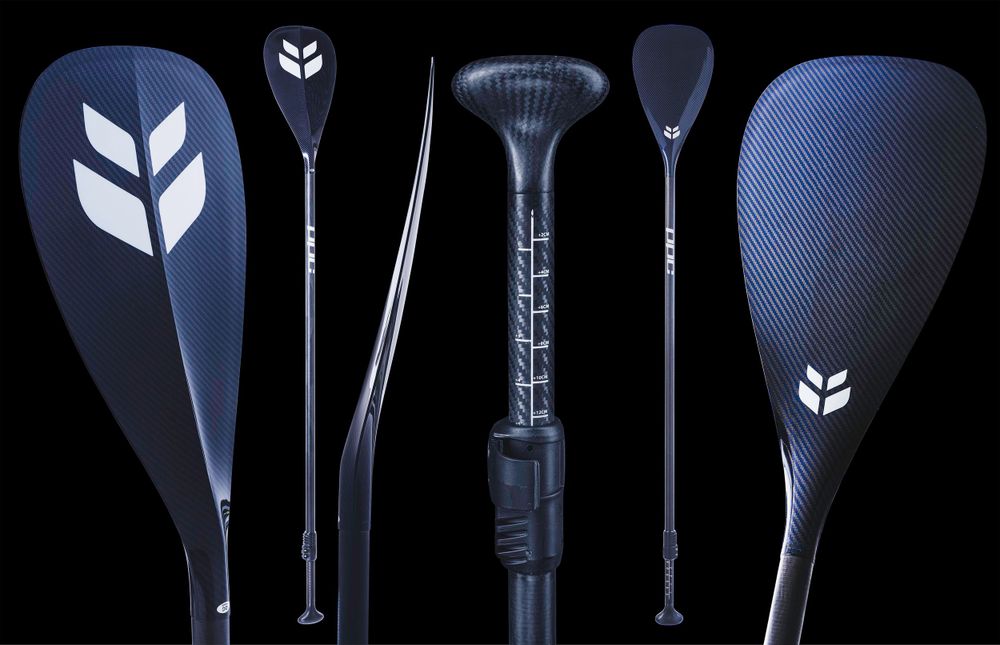 Collection of dark blue carbon fiber paddles with white chevron logo designs.