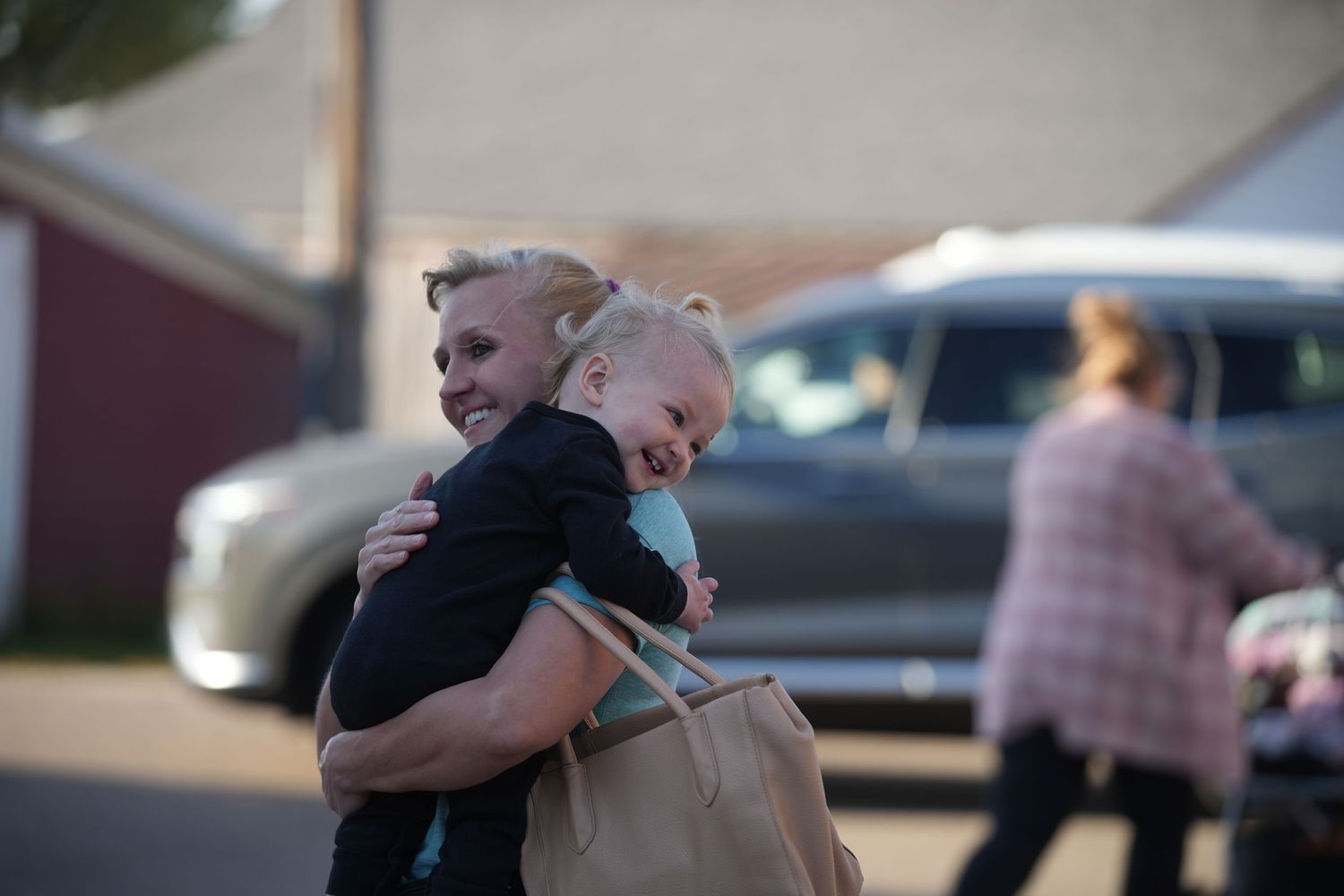 A series of photos showing people embracing and hugging each other outdoors in a parking lot.