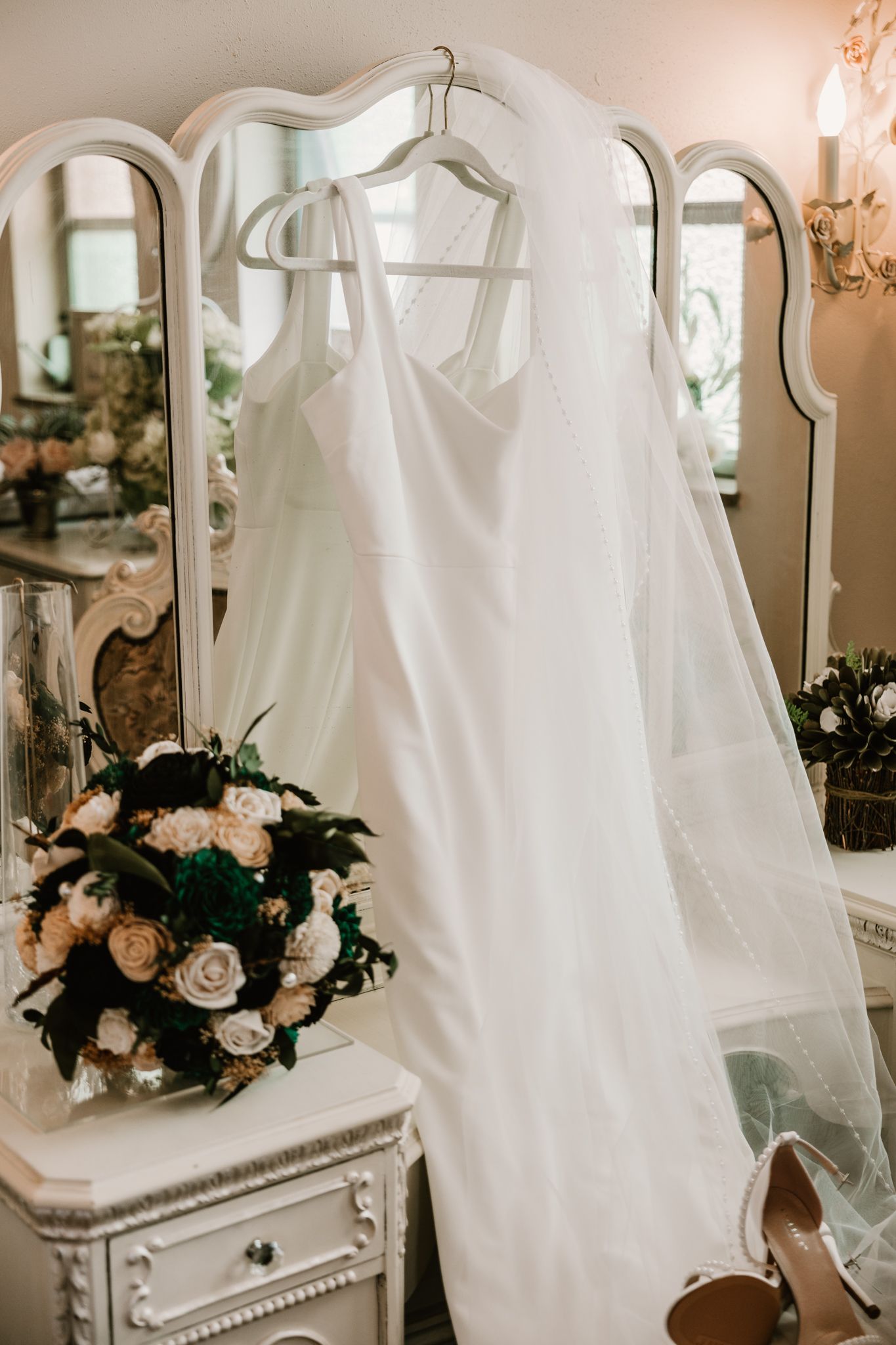 Simple wedding dress detail shot by Dainty Rose Photography—capturing the elegant, timeless beauty of your gown's unique features.