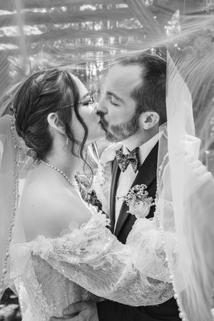 Black and white wedding scene collage showing romantic moments in vintage lace dress.