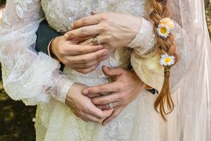 Detail shots of delicate lace wedding dress fabric and floral accessories.
