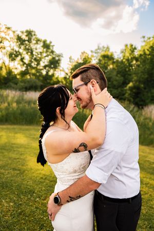 Wedding couple shares romantic kisses during golden hour photoshoot.