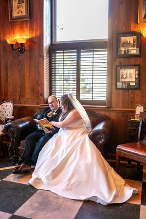 A series of photos showing someone resting under a white sheet on a couch in a rustic wood-paneled room.