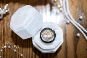 Close-up of elegant white napkins and place settings with crystal decor at a formal event.