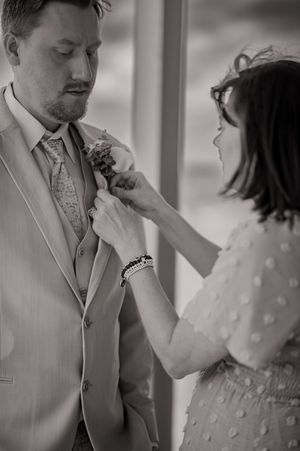 Black and white intimate wedding portraits showing tender moments between newlyweds.