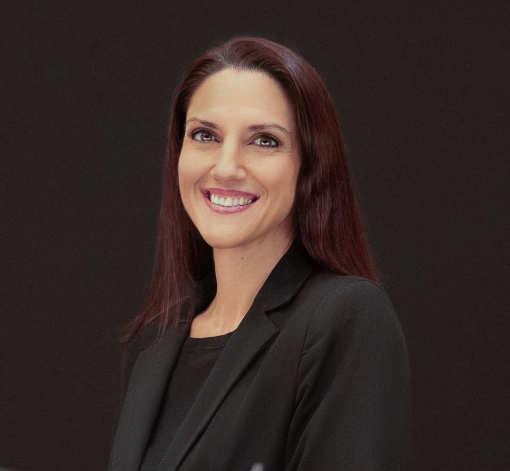 Professional headshot series showing someone in a black blazer against dark background with warm lighting.