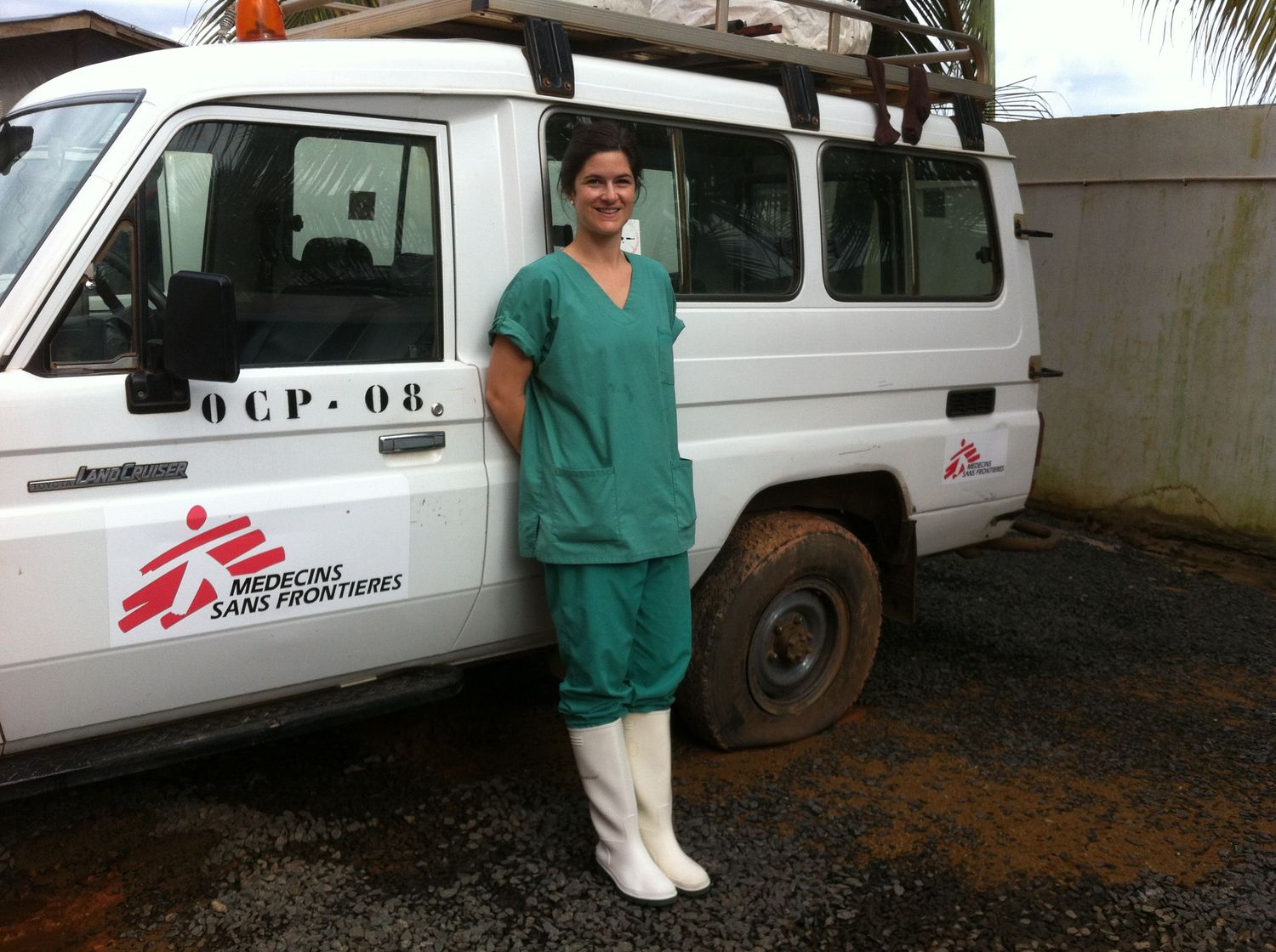 White medical vehicles parked in a row with MSF Doctors Without Borders logos.
