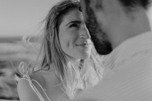 Couple elopement by the sea — barefoot, moody, and timeless.
