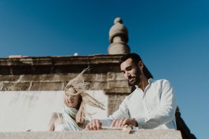 Elopement in Portugal with wild wind, messy hair, and unfiltered joy.