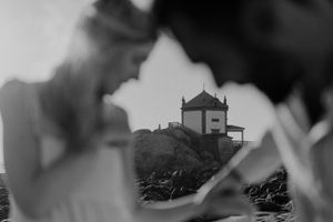 Close-up of elopement vows exchange near the lighthouse in Portugal