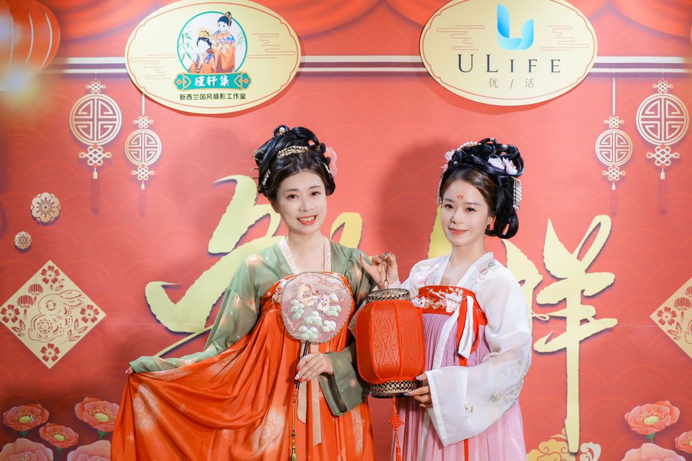 Joyful corporate event photography featuring a group in traditional Hanfu at a company party, by an Auckland event photographer.