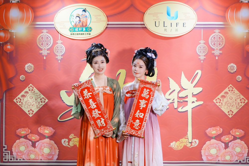 Joyful corporate event photography featuring a group in traditional Hanfu at a company party, by an Auckland event photographer.