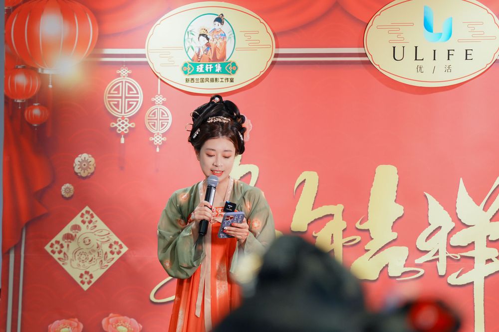 Joyful corporate event photography featuring a group in traditional Hanfu at a company party, by an Auckland event photographer.