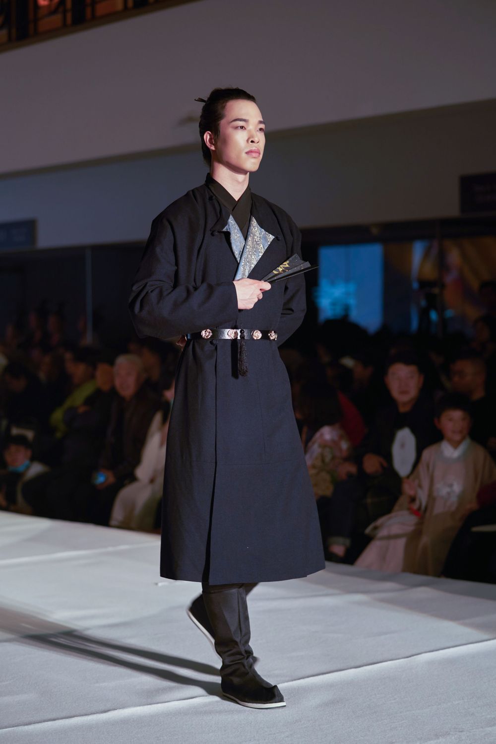 Dramatic stage photography of a traditional Hanfu fashion show featuring elegant performers, by an Auckland event photographer.