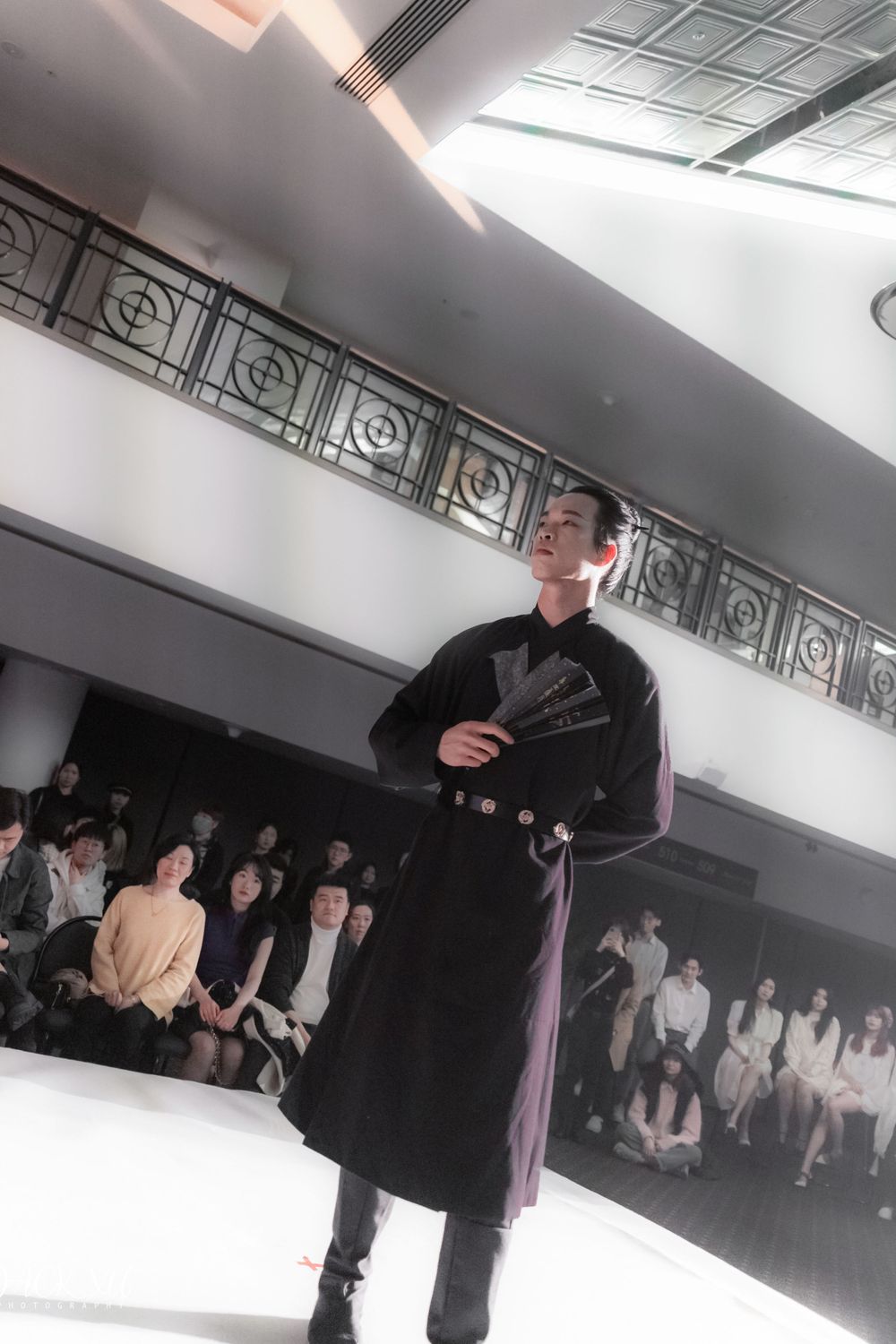Dramatic stage photography of a traditional Hanfu fashion show featuring elegant performers, by an Auckland event photographer.
