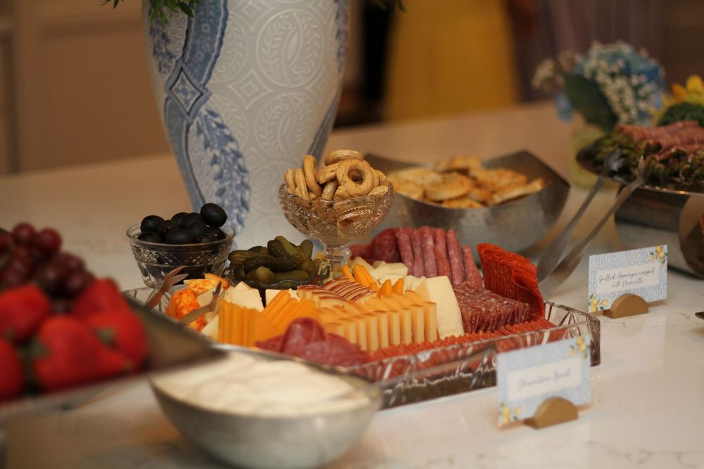 Assorted appetizers and snacks displayed on platters at a buffet or party spread.