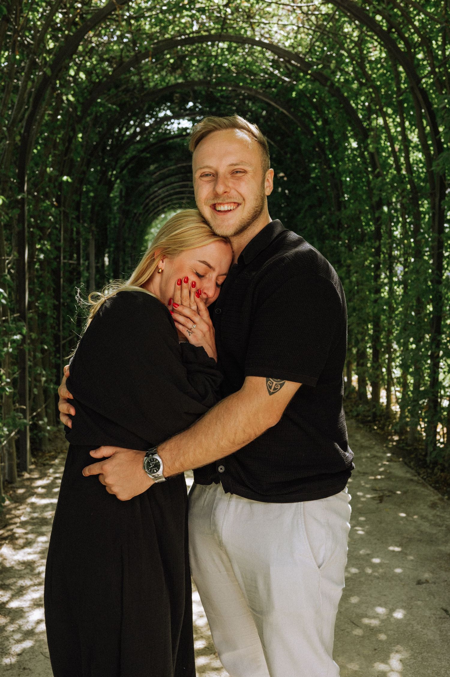 uthentic emotions of a couple just after their surprise engagement in the Rijksmuseum Gardens, Amsterdam.