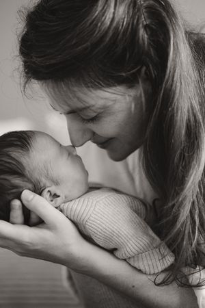 Intimate black and white portrait showing a tender moment of affection.
