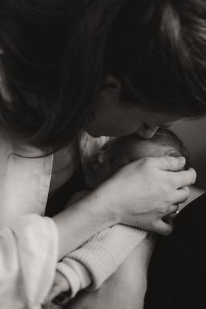 Artistic black and white photograph capturing an intimate moment of connection.