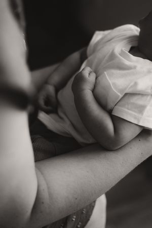 Black and white macro shots of gentle hands and tender touches.