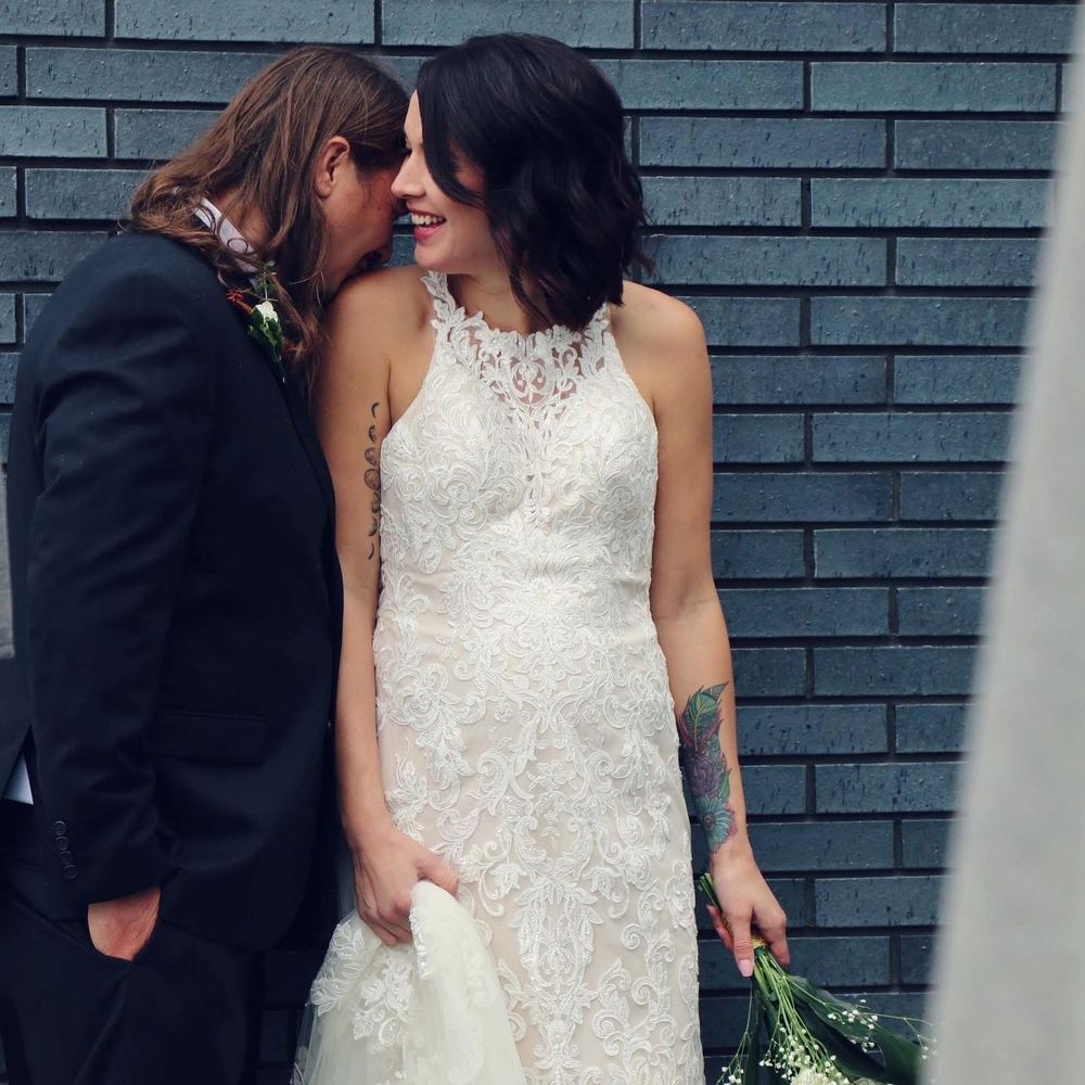 Brick walls and a break from the rain...beautiful...these two don't even have to try! Beautiful wedding with family.
