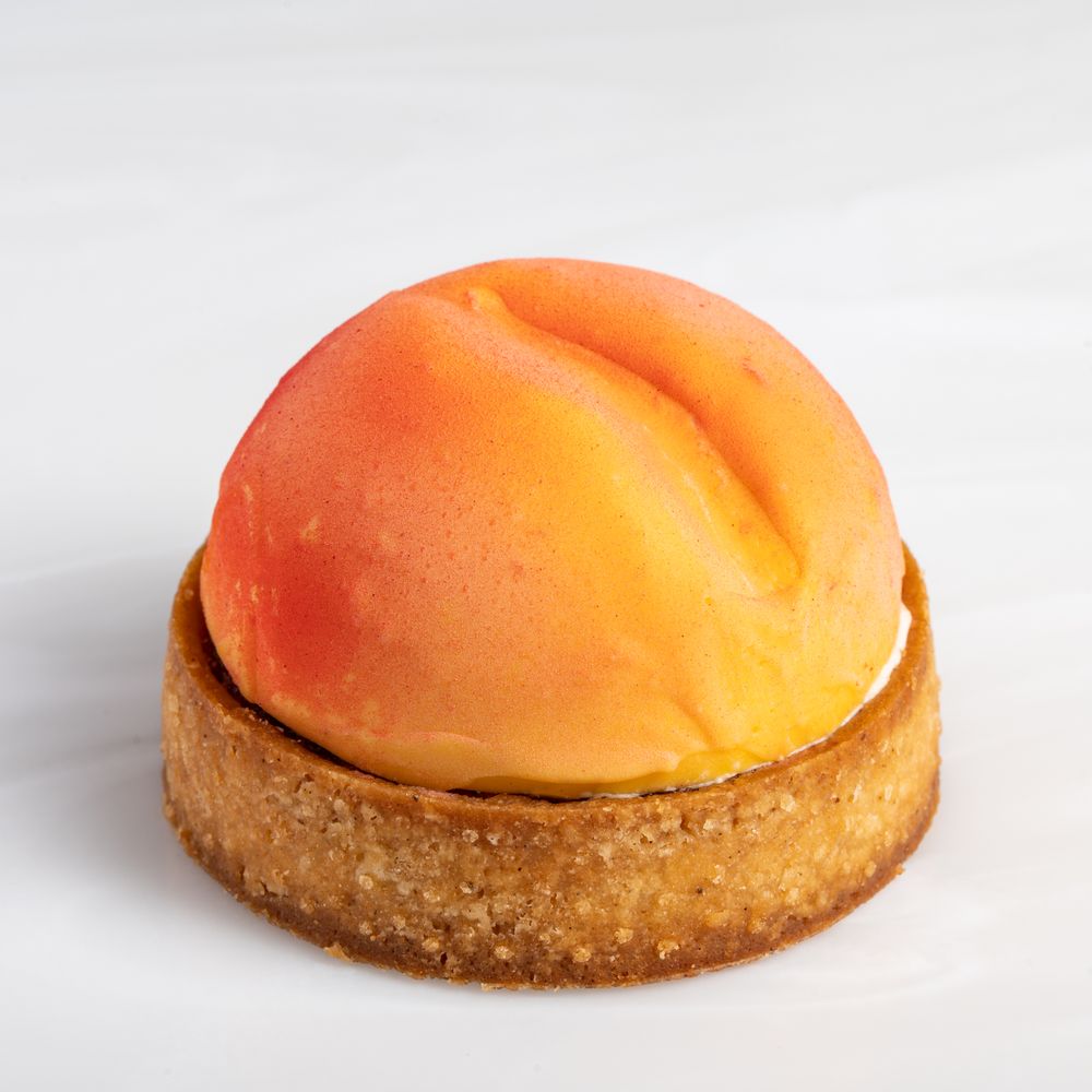 Assorted personal-sized desserts styled for Lumière Patisserie, captured in a professional food photography setup.