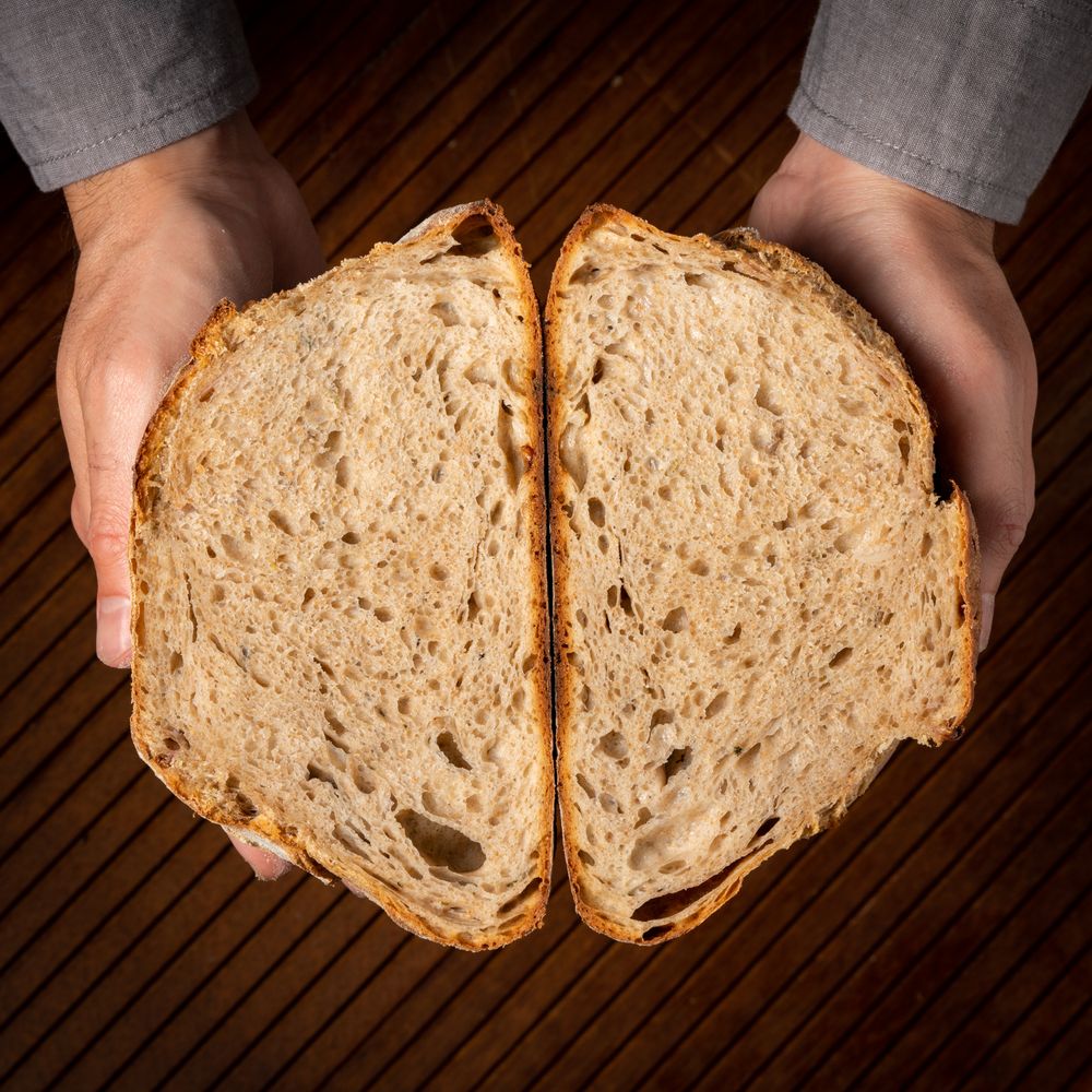 Close-up photo of a loaf of sourdough bread with a crispy crust.