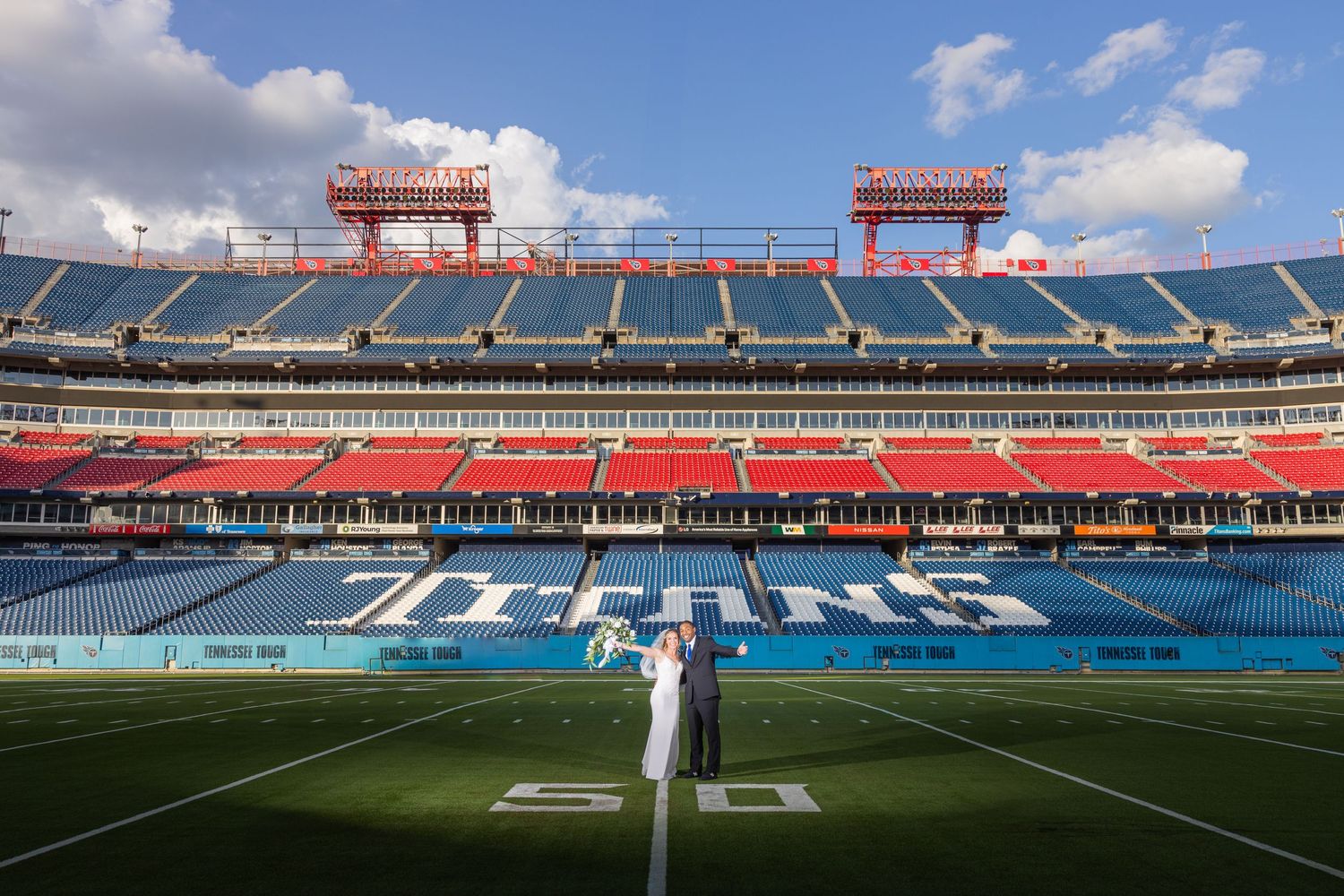 Nissan Stadium Wedding By Josh Bennett Photography. Bride and Groom on the Tennessee Titans Field.