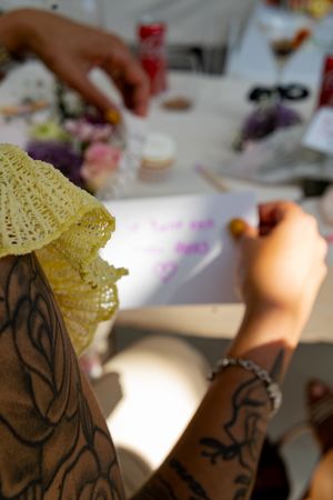 Close-up shots of yellow lace decorative elements on a craft project.