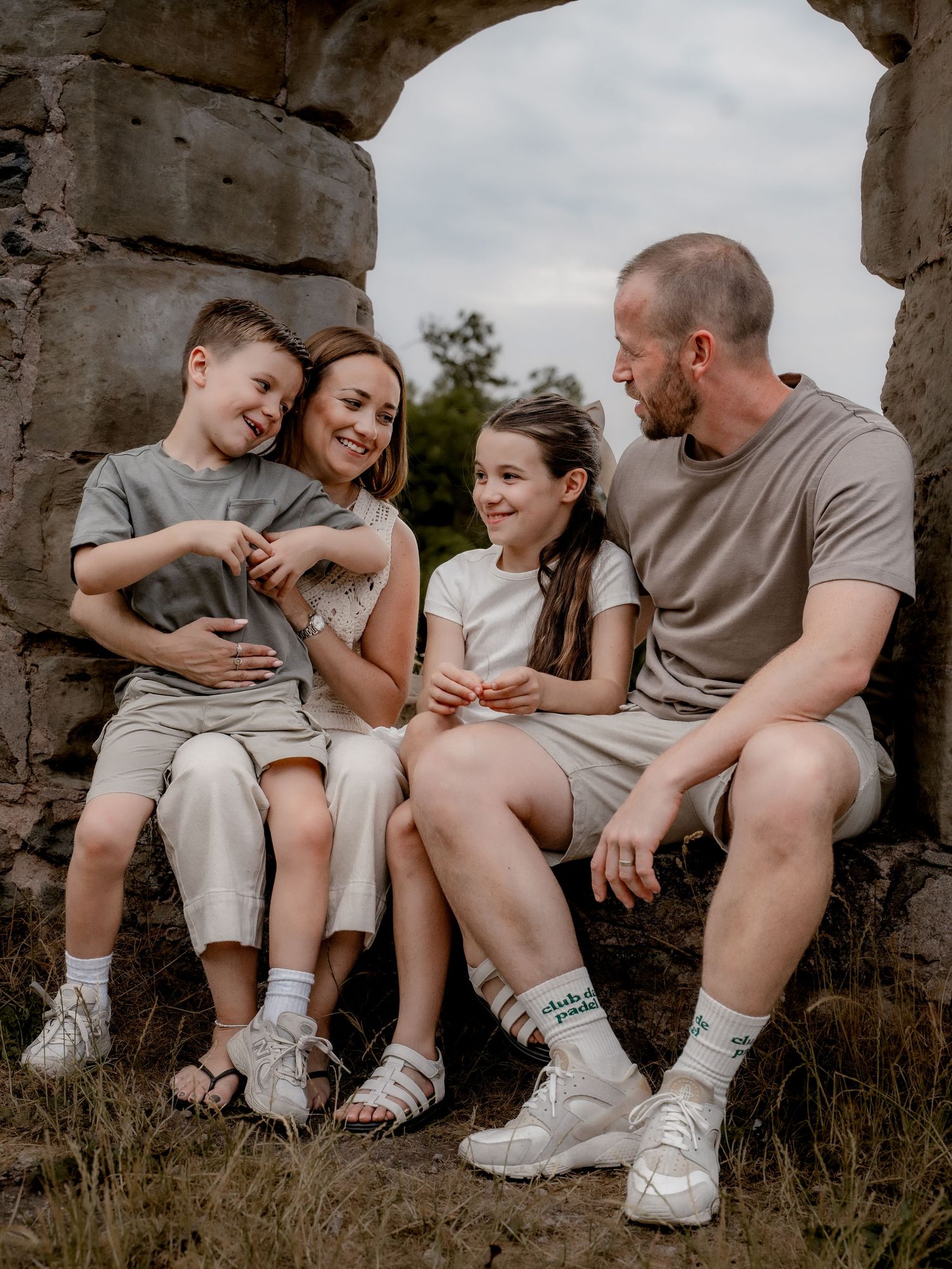 Little hands reaching for mum, laughter echoing—authentic connection captured during a relaxed family shoot in Derbyshire.