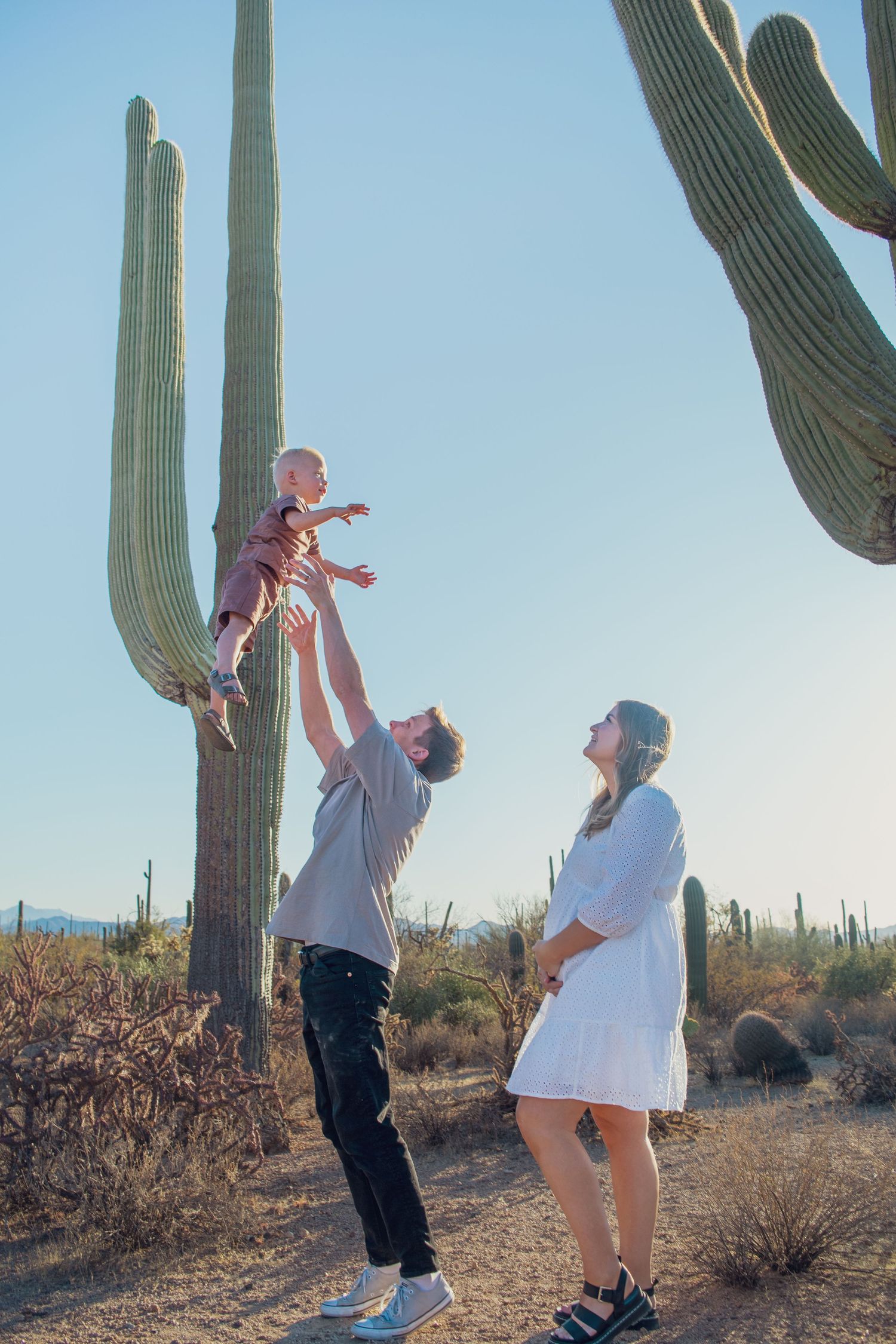family plays together in Saguaro National Park, Tucson, Arizona