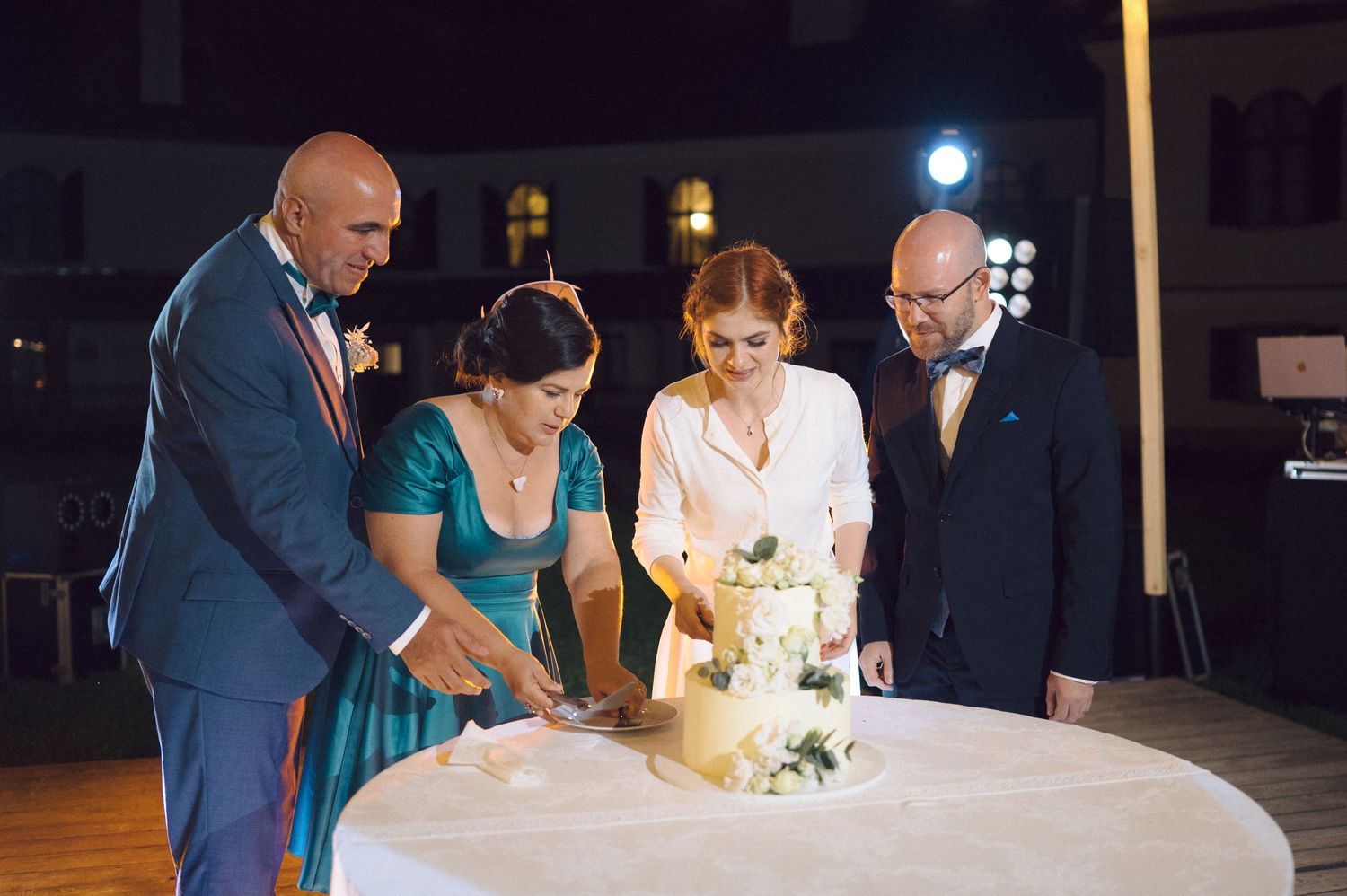 Sequence of wedding photos showing couple pouring champagne or wine together in a dark reception setting.