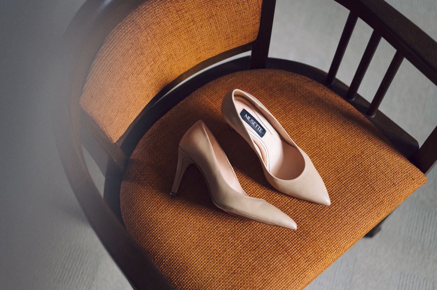 A close-up abstract series shows a sleek computer mouse casting dramatic shadows on textured brown fabric surfaces.
