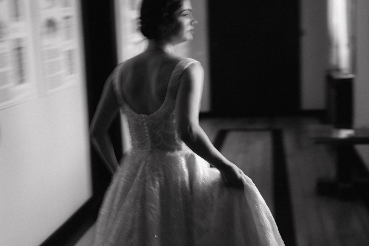 Artistic black and white photo series showing silhouettes of a woman in a white dress dancing in a bright window.