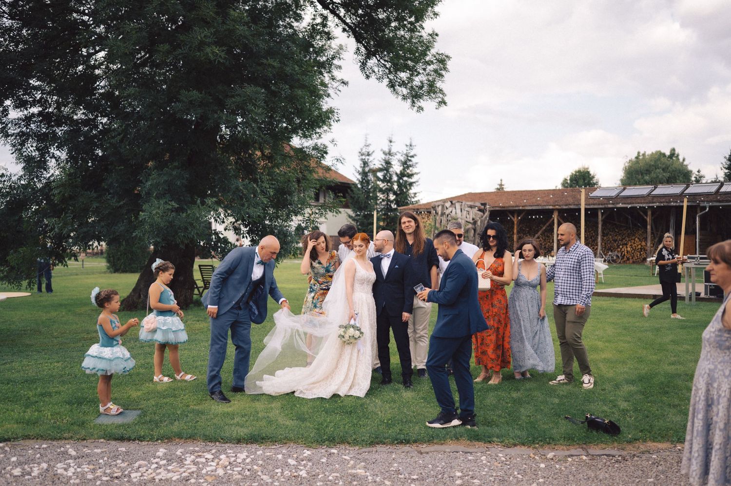 A series of outdoor wedding celebration photographs showing people gathering on a lush green lawn during a summer event.