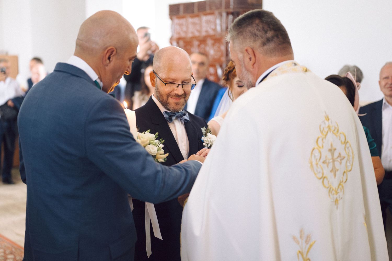 A sequence of wedding ceremony moments showing elegantly dressed people interacting during a formal celebration.