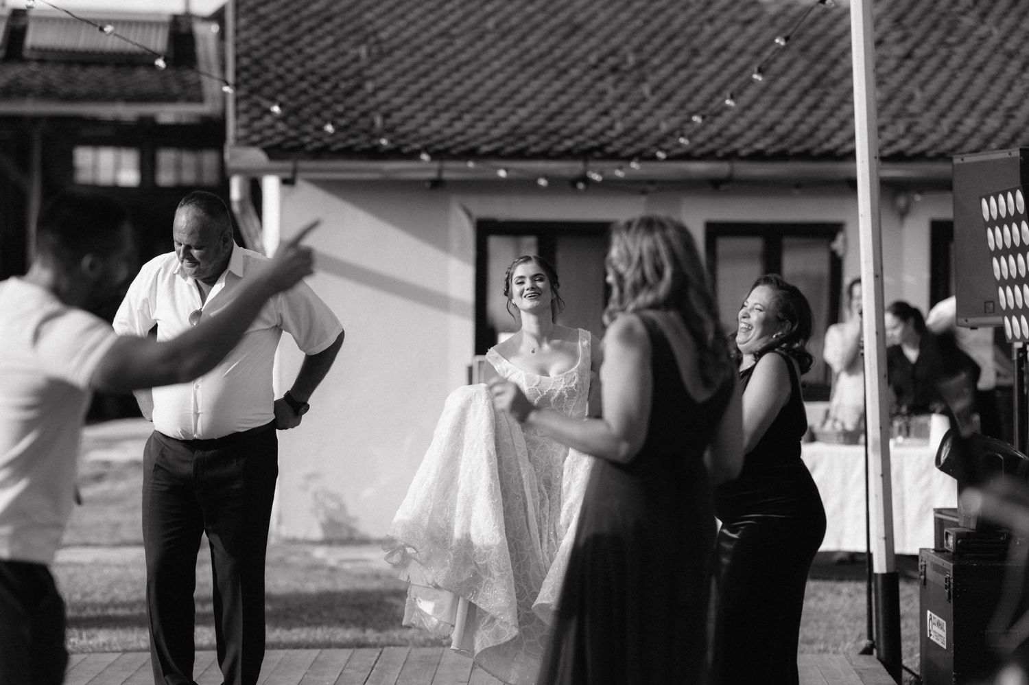 A black and white photo montage of bride and groom dancing at various angles during their wedding celebration.