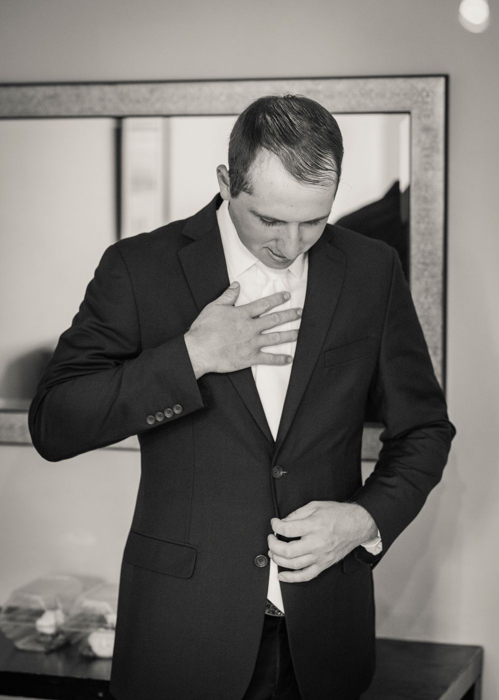 Series of black and white photos showing emotional reactions in formal attire.